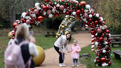 Visitors in the bauble arches in the picnic area